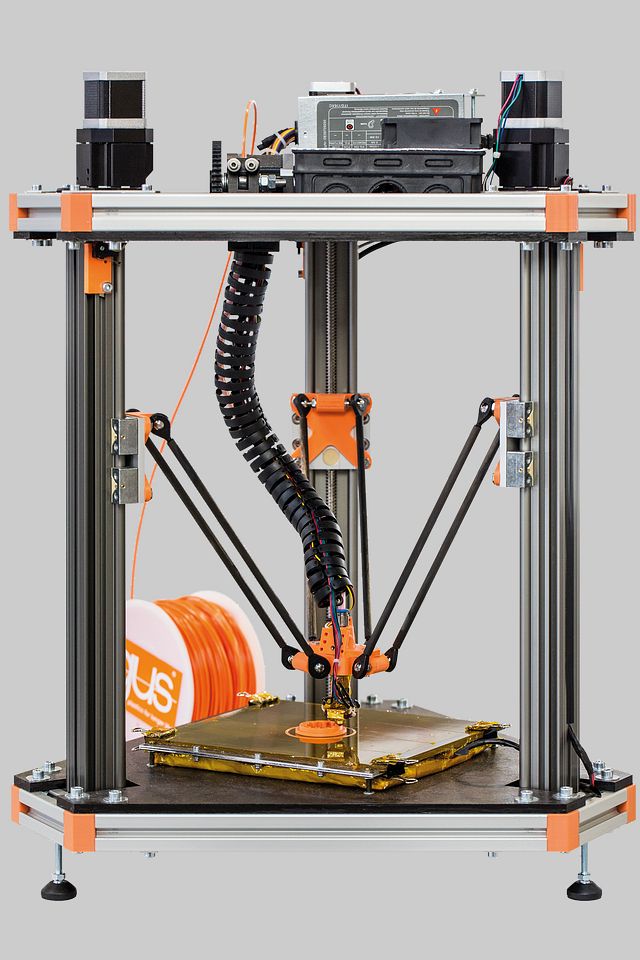 An FDM 3D printer in the middle of printing an object