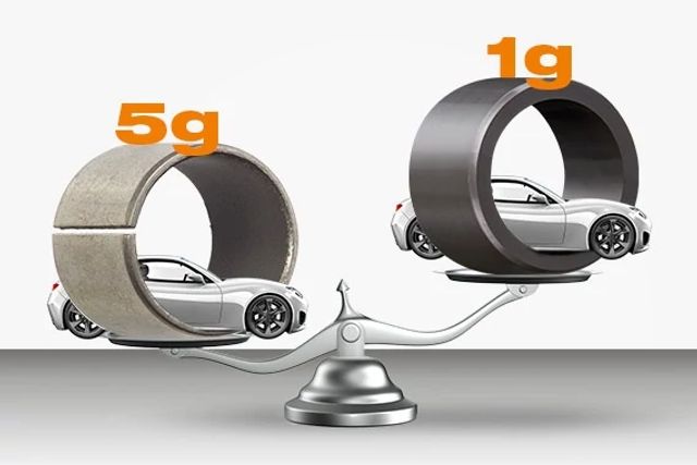 A weight comparison of a metal and a plastic bearing, the metal bearing weighing 5 grams and the plastic bearing weighing 1 gram