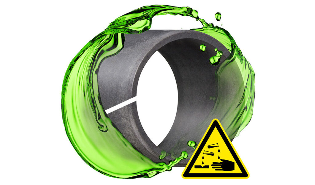 iglide clip bearing shown with a green chemical liquid splashing around it and a chemical hazard logo