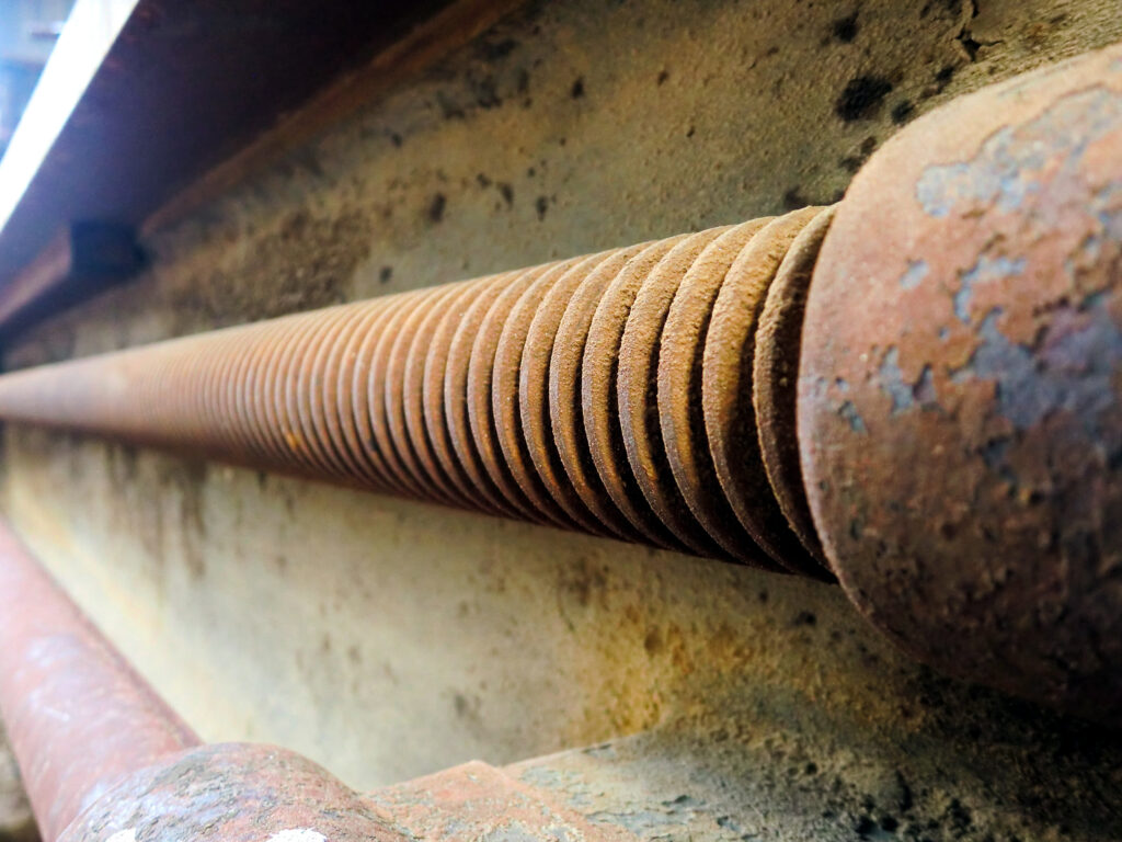 A rusted ball screw assembly in a marine environment