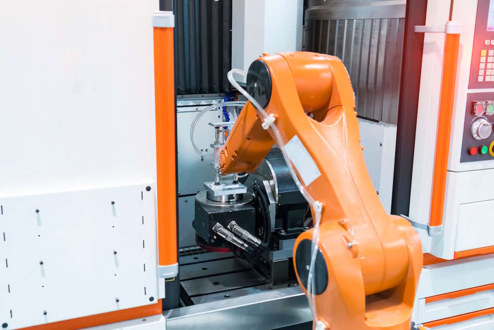 robot arm tending a machine tool