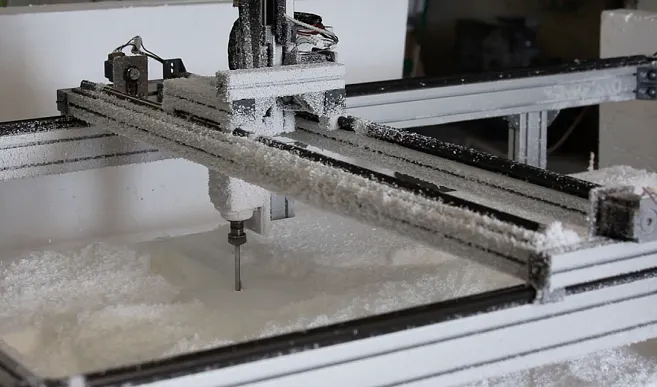 A dry-running machine tool gantry operating in an environment with significant amounts of dust and debris